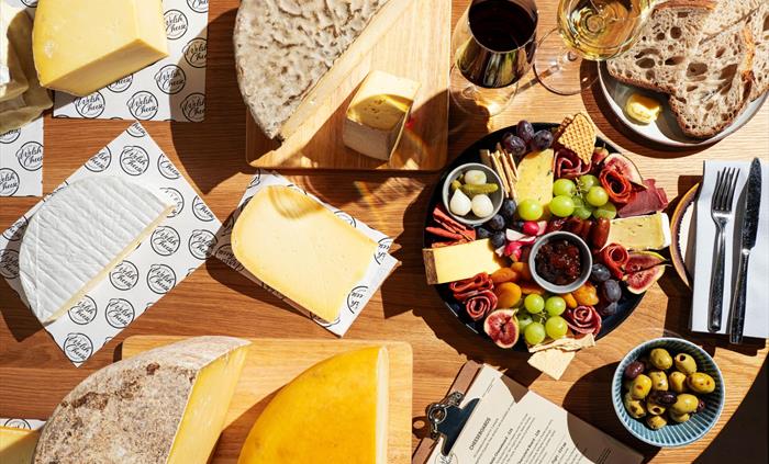 Overhead shot of Welsh cheeses and cheeseboard